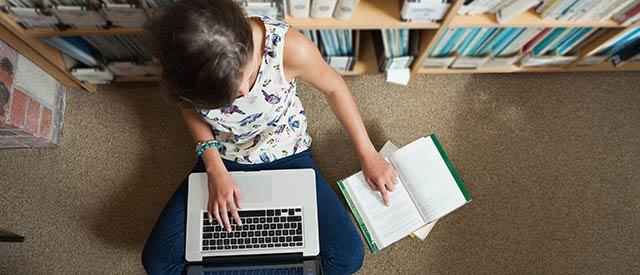 aerial view of student using laptop 